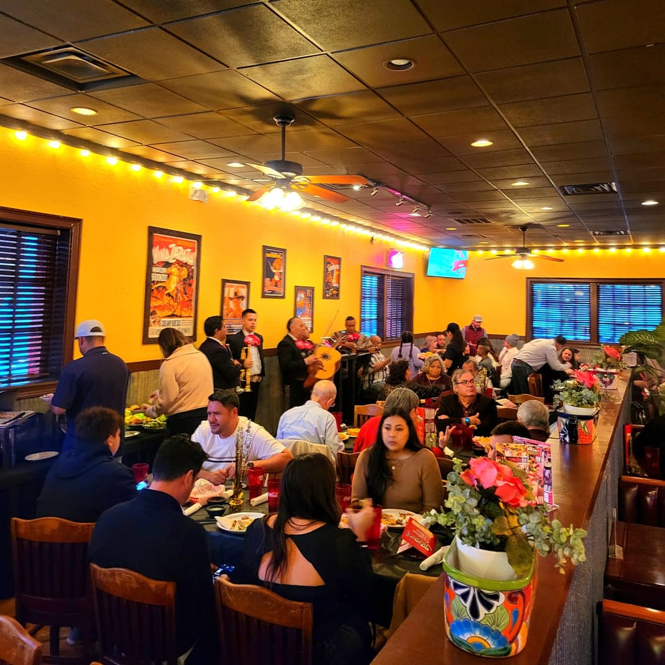 Maria Rita's Tex-Mex restaurant interior with mariachi band playing for dining customers.