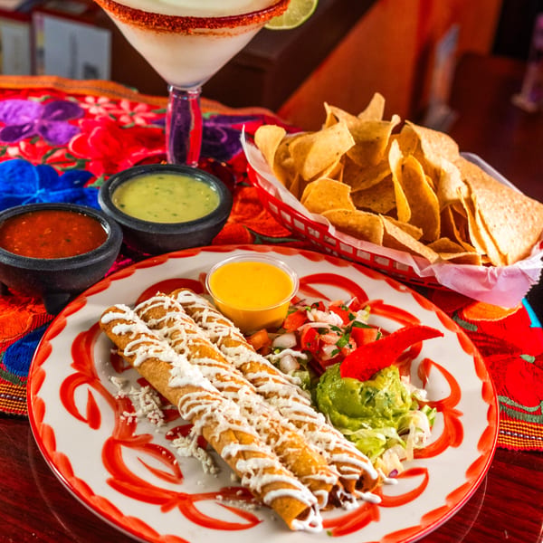 Maria Rita's Tex-Mex flautas with guacamole, pico de gallo, queso, salsa, and chips.